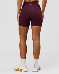 Woman wearing Rep Ultra High-Rise 4" Short Pockets - Cherry Lacquer-White | Model:Issy | Size:XS | Thumbnail Index: 7