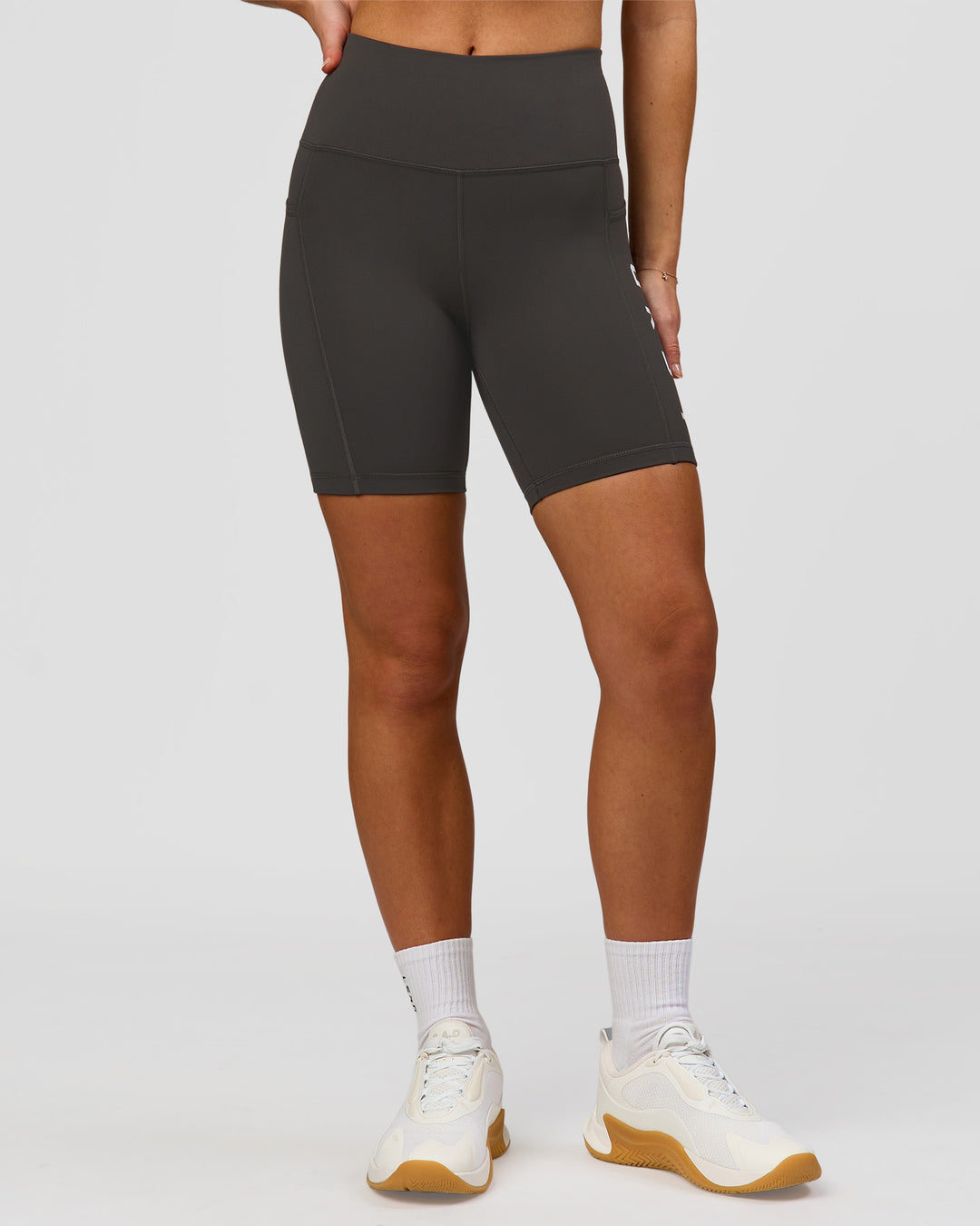 Woman wearing Rep Ultra High-Rise 6" Short Pockets - Onyx-white | Model:Issy | Size:XS - view 5