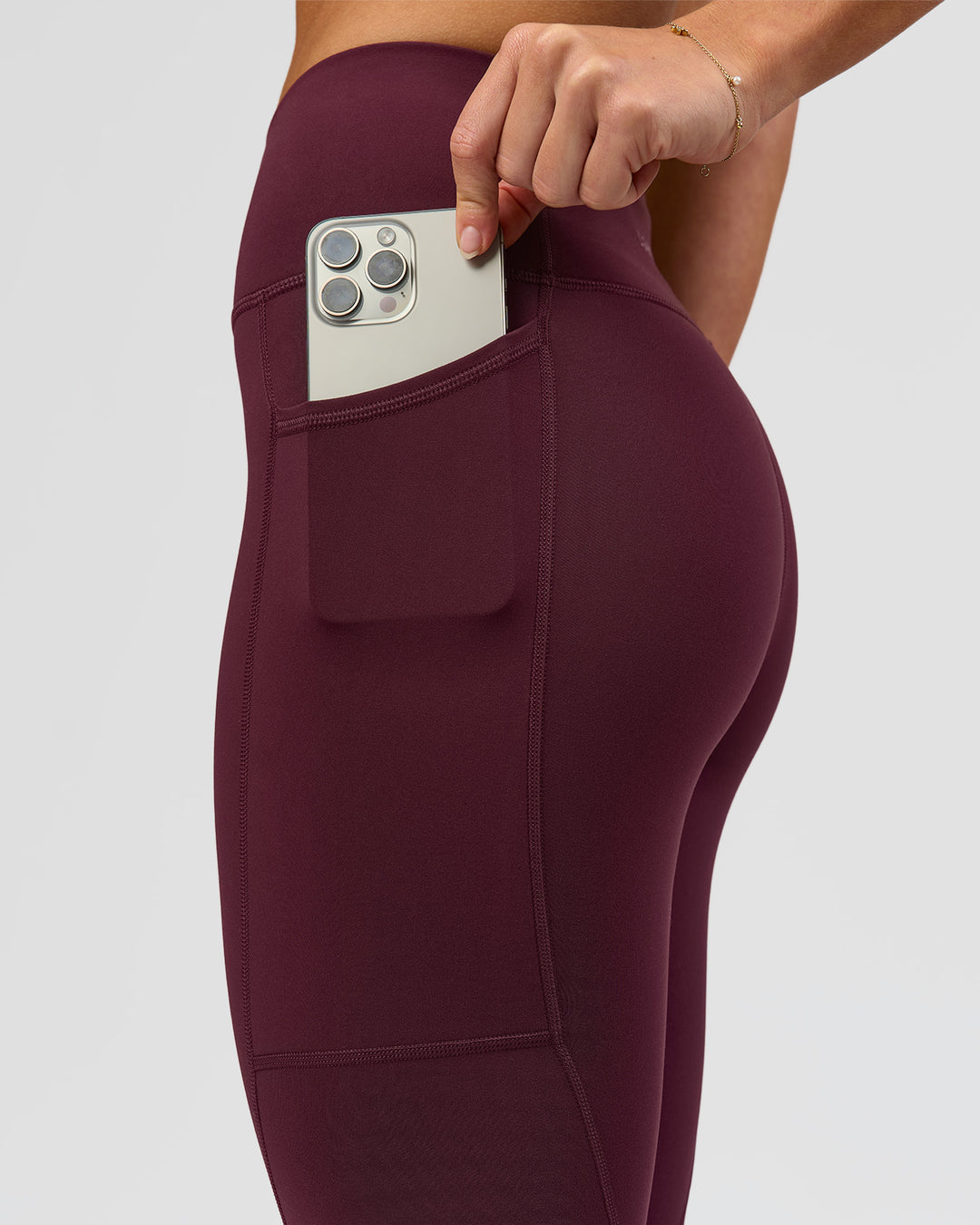Woman wearing Rep Ultra High-Rise 7/8 Legging Pockets - Cherry Lacquer-White | Model:Issy | Size:XS - view 6