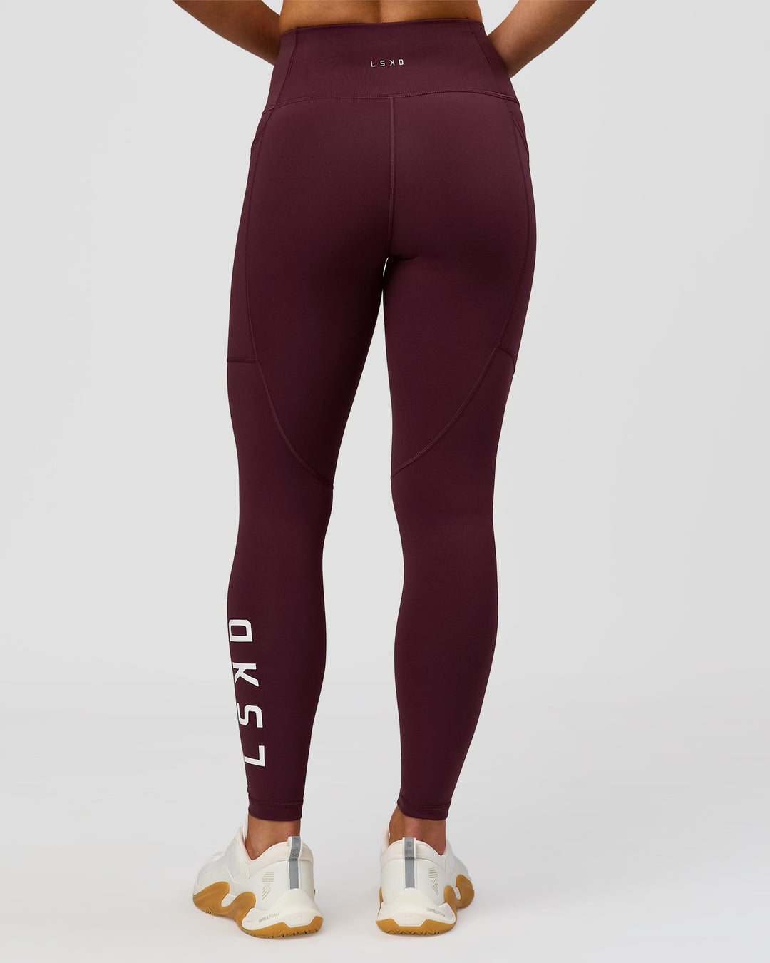 Woman wearing Rep Ultra High-Rise 7/8 Legging Pockets - Cherry Lacquer-White | Model:Issy | Size:XS - view 8