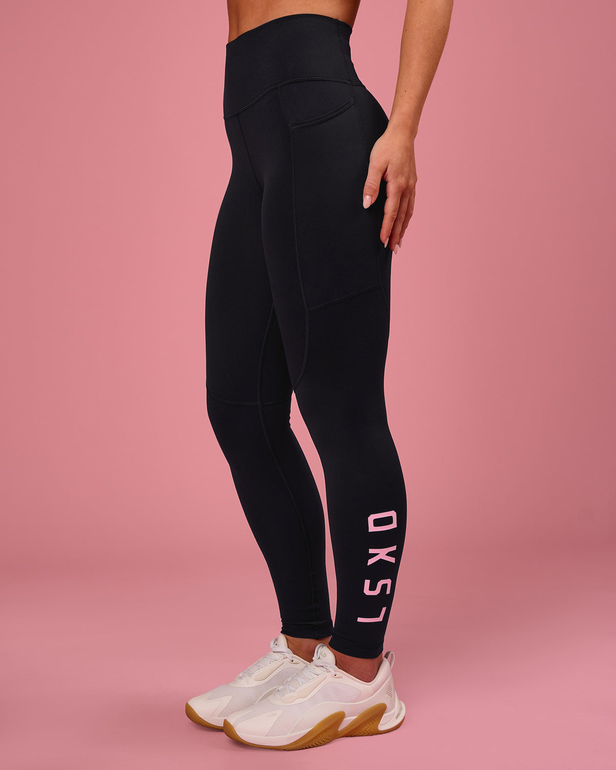 Woman wearing Rep Ultra High-Rise Full Length Legging Pockets - Black-Pink Rose | Model:Issy | Size:XS - view 1