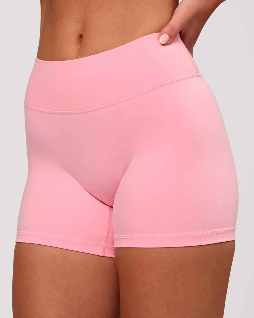Woman wearing RXD Mid-Rise 4" Short - Pink Rose | Model:Issy | Size:XS - view 1