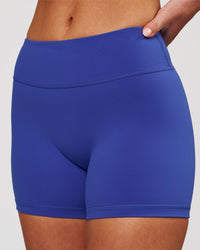Woman wearing RXD Mid-Rise 4" Short - Power Cobalt | Model:Issy | Size:XS | Thumbnail Index: 0