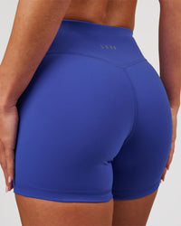 Woman wearing RXD Mid-Rise 4" Short - Power Cobalt | Model:Issy | Size:XS | Thumbnail Index: 1