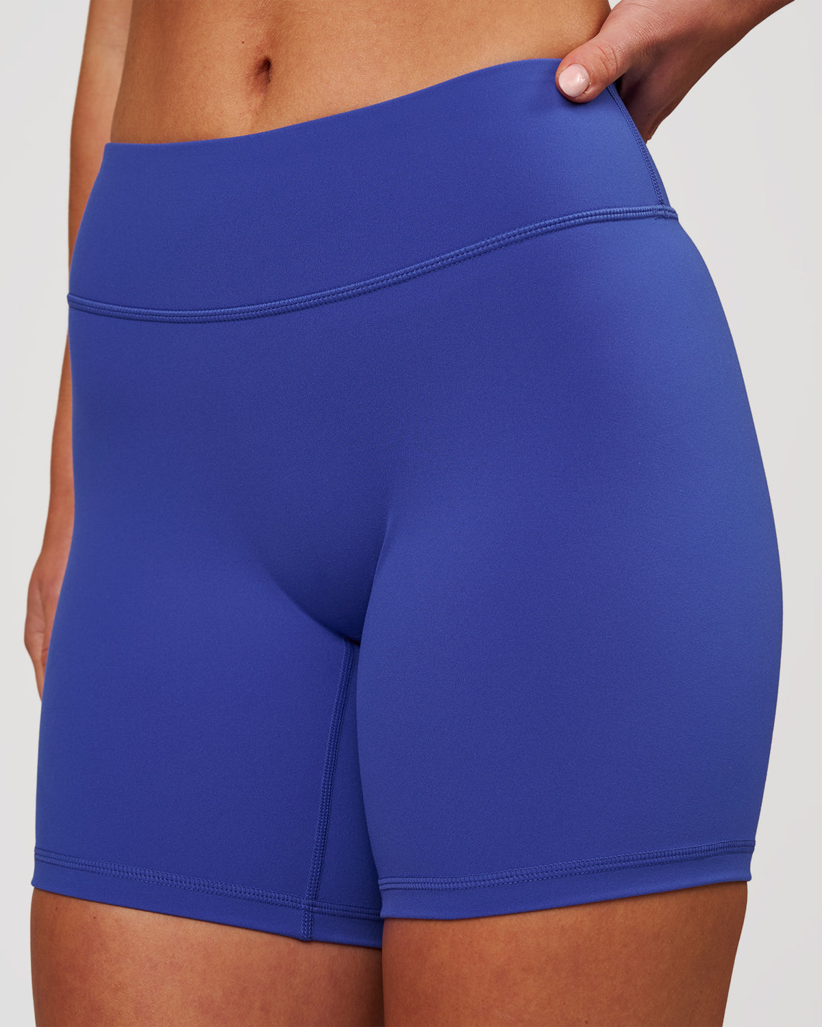Woman wearing RXD Mid-Rise 6" Short - Power Cobalt | Model:Issy | Size:XS