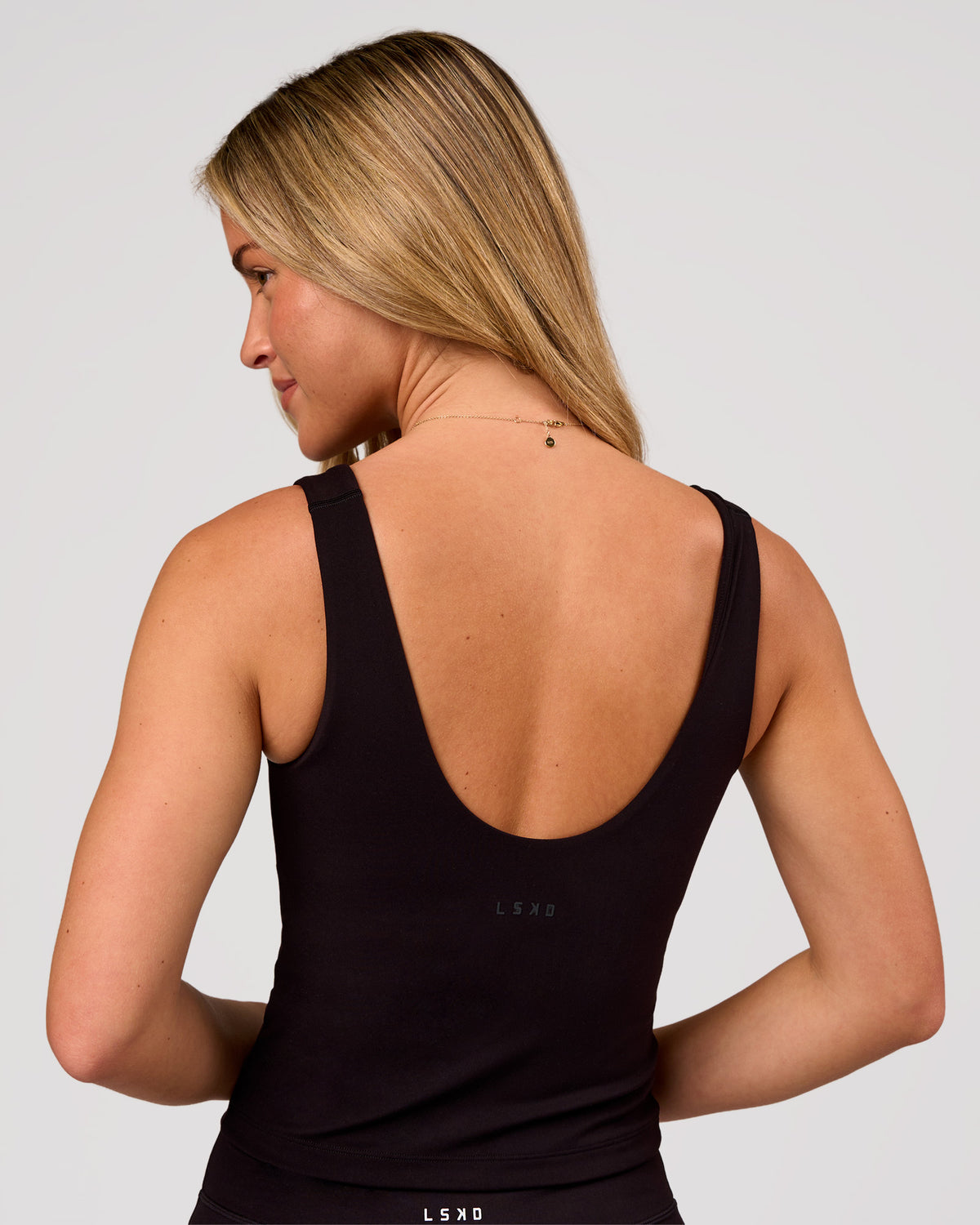 Woman wearing Staple 2.0 Active Shelf Bra Tank - Black | Model:Issy | Size:XS