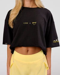 Woman wearing TGHF X LSKD 26 FLXCotton Oversized Tee - Black | Model:Issy | Size:XS | Thumbnail Index: 5