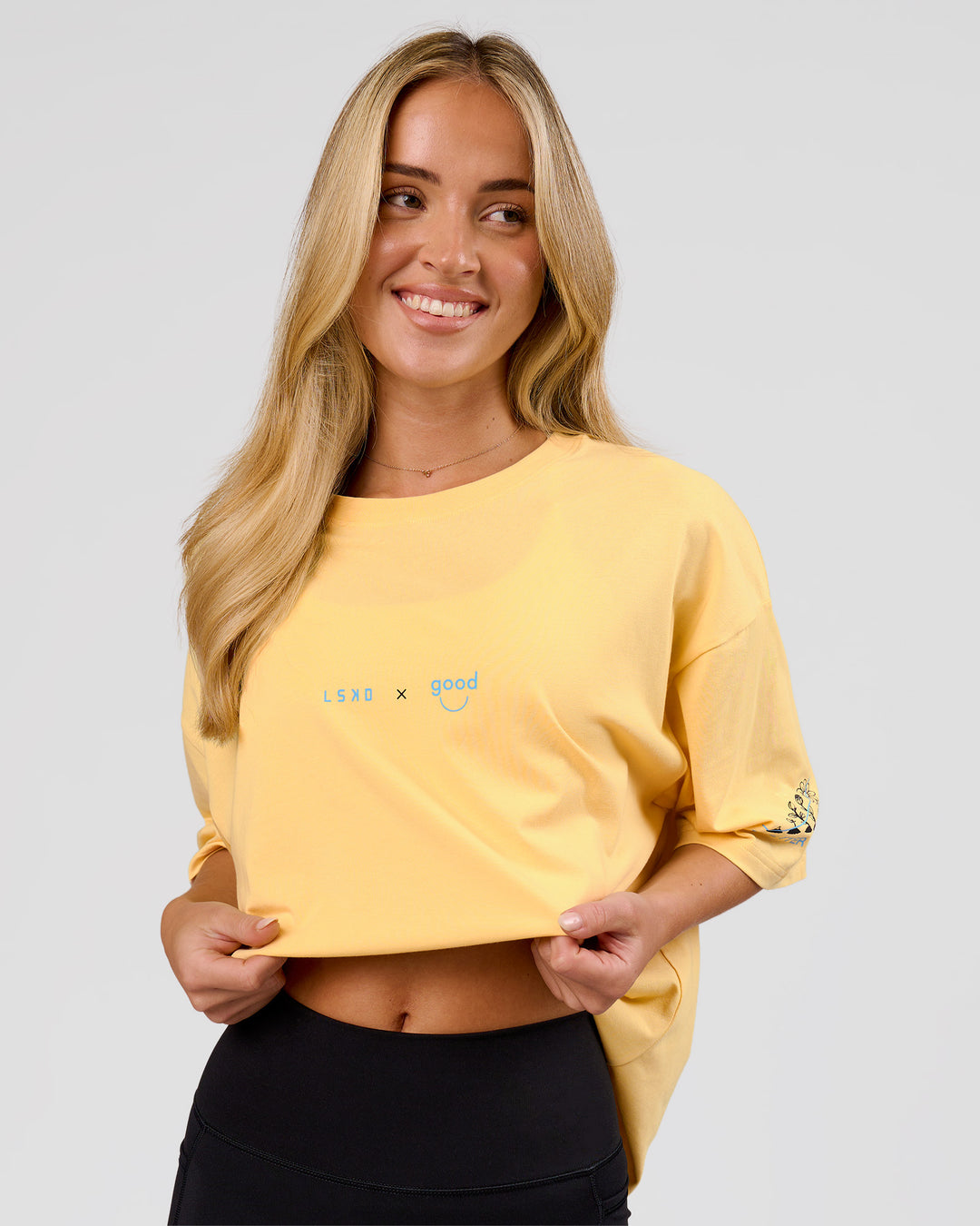 Woman wearing TGHF X LSKD 26 FLXCotton Oversized Tee - Lemon | Model:Issy | Size:XS - view 6