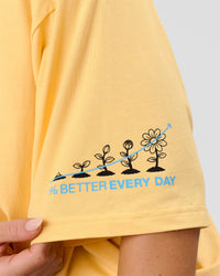 Woman wearing TGHF X LSKD 26 FLXCotton Oversized Tee - Lemon | Model:Issy | Size:XS | Thumbnail Index: 7