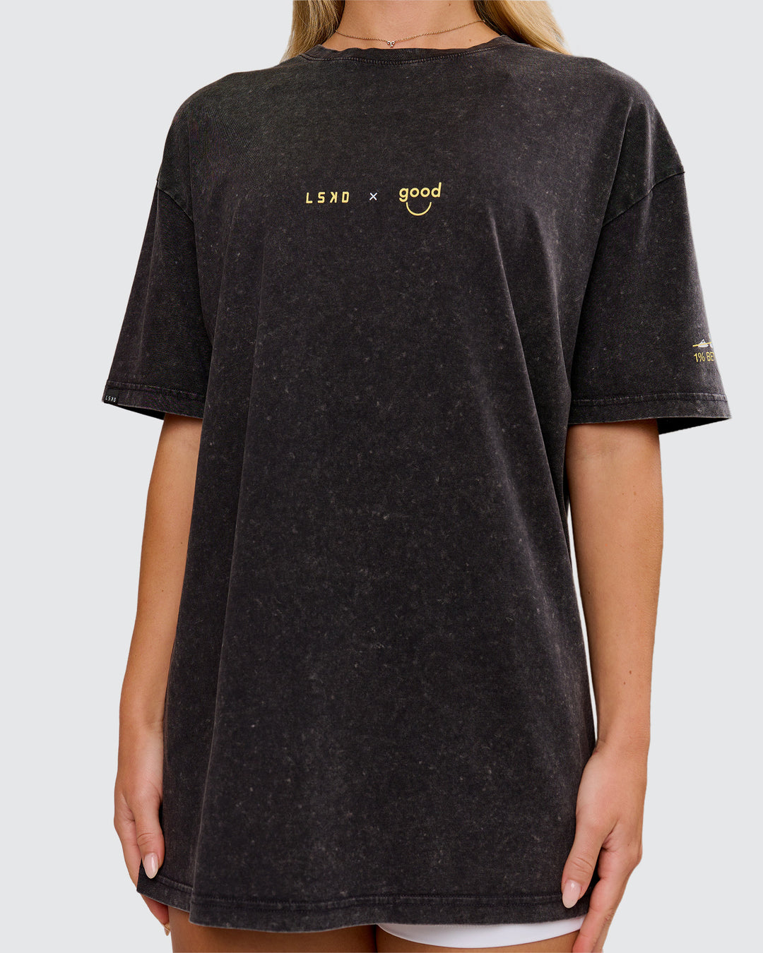 Woman wearing TGHF X LSKD 26 FLXCotton Oversized Tee - Black Washed | Model:Issy | Size:XS - view 4