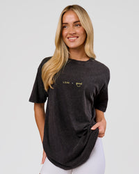 Woman wearing TGHF X LSKD 26 FLXCotton Oversized Tee - Black Washed | Model:Issy | Size:XS | Thumbnail Index: 8