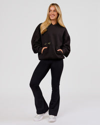Woman wearing TGHF X LSKD 26 Oversized Hoodie - Black | Model:Issy | Size:XS | Thumbnail Index: 14