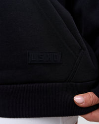 Woman wearing Tonal Legacy Boxy Hoodie - Black-Black | Model:Issy | Size:XS | Thumbnail Index: 16