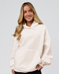 Woman wearing Tonal Legacy Boxy Hoodie - Off White-Off White | Model:Issy | Size:XS | Thumbnail Index: 5