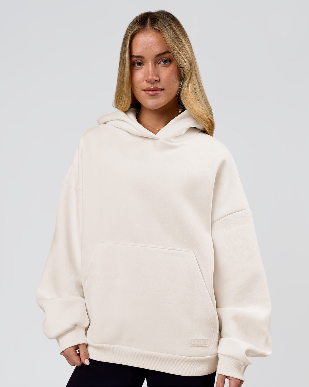 Woman wearing Tonal Legacy Boxy Hoodie - Off White-Off White | Model:Issy | Size:XS - view 9