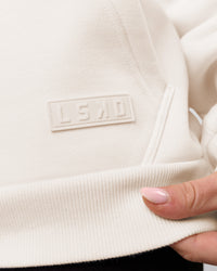 Woman wearing Tonal Legacy Boxy Hoodie - Off White-Off White | Model:Issy | Size:XS | Thumbnail Index: 15