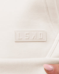 Woman wearing Tonal Legacy Boxy Hoodie - Off White-Off White | Model:Issy | Size:XS | Thumbnail Index: 17