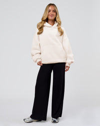 Woman wearing Tonal Legacy Boxy Hoodie - Off White-Off White | Model:Issy | Size:XS | Thumbnail Index: 20