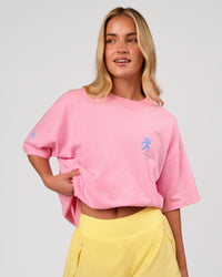 Woman wearing Values Manifesto Heavyweight Oversized Tee  - Pink Rose-Open Air | Model:Issy | Size:XS | Thumbnail Index: 2