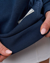 Woman wearing Varsity Boxy Hoodie - Future Navy-White | Model:Issy | Size:XS | Thumbnail Index: 19