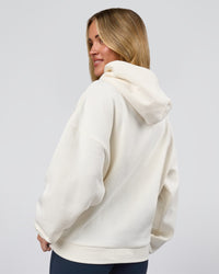 Woman wearing Varsity Boxy Hoodie - Off White-Pink Rose | Model:Issy | Size:XS | Thumbnail Index: 12