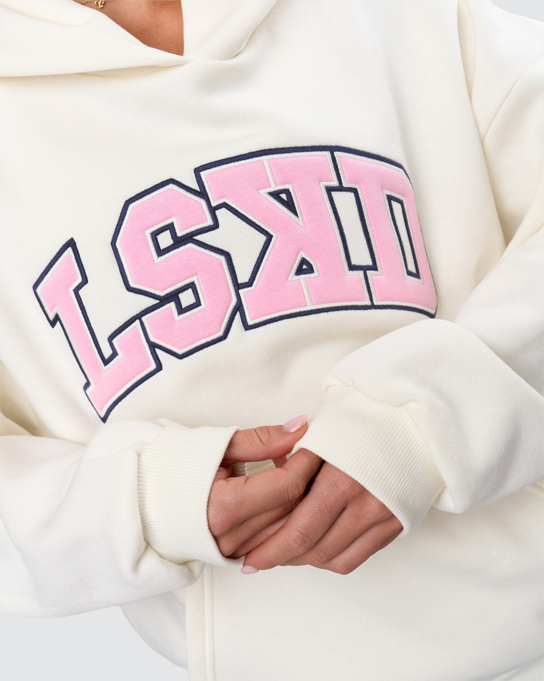 Woman wearing Varsity Boxy Hoodie - Off White-Pink Rose | Model:Issy | Size:XS - view 17