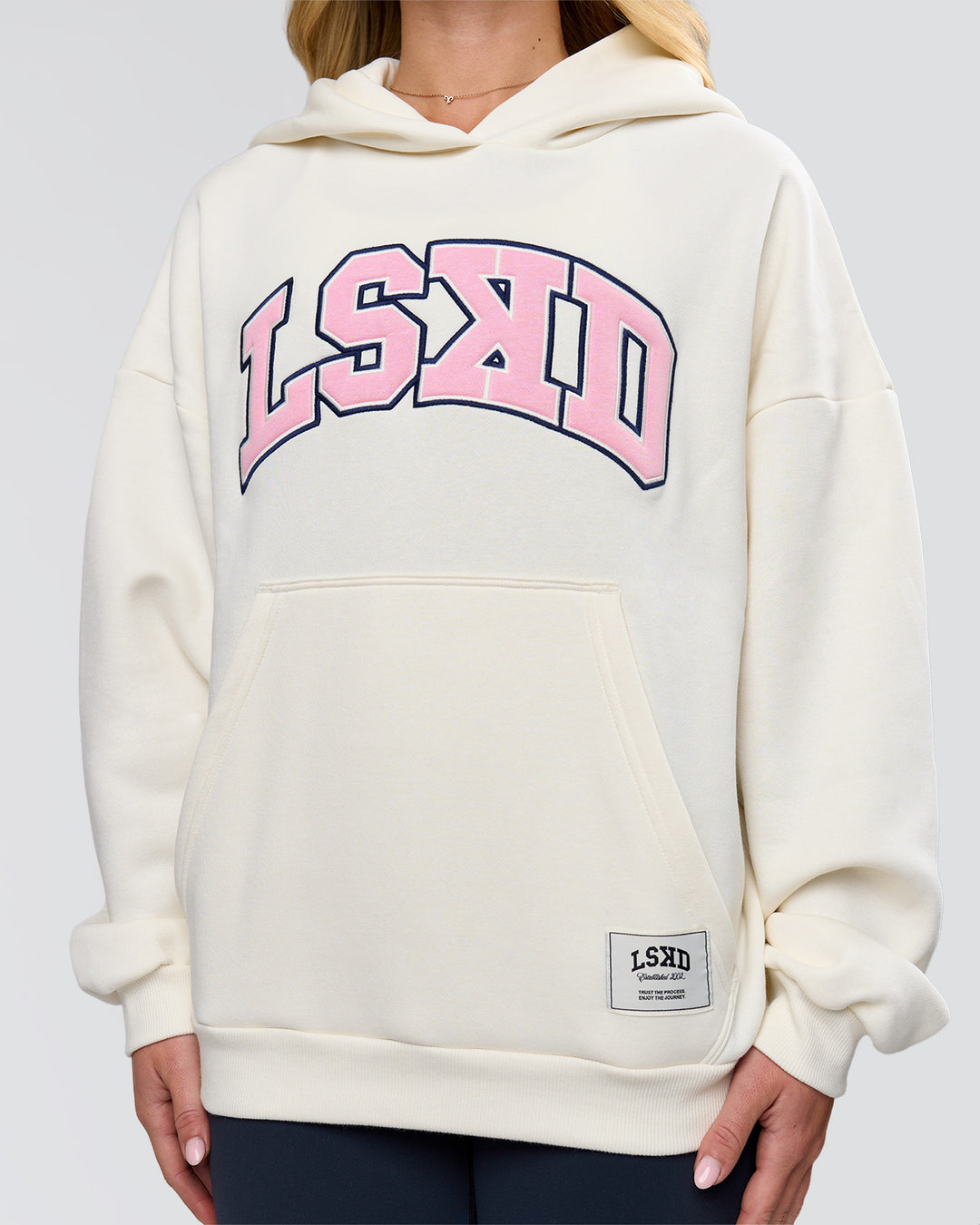 Woman wearing Varsity Boxy Hoodie - Off White-Pink Rose | Model:Issy | Size:XS - view 19