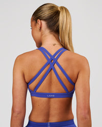 Woman wearing Velocity Sports Bra - Power Cobalt | Model:Issy | Size:XS | Thumbnail Index: 3