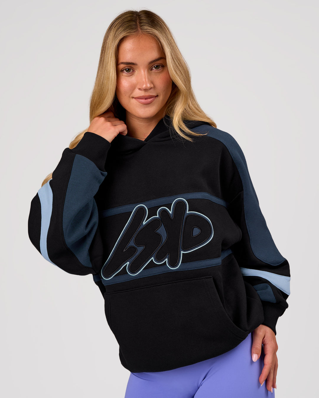 Woman wearing Vibe Oversized Hoodie - Black-Future Navy | Model:Issy | Size:XS - view 3