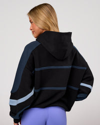 Woman wearing Vibe Oversized Hoodie - Black-Future Navy | Model:Issy | Size:XS | Thumbnail Index: 7