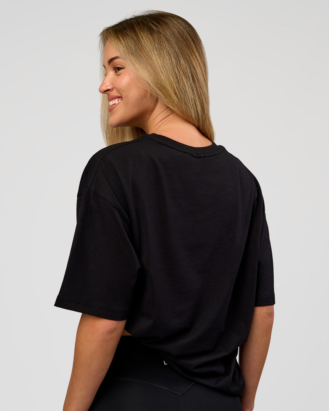 Woman wearing VS1 Enjoy The Journey FLXCotton Oversize Tee - Black | Model:Issy | Size:XS - view 6