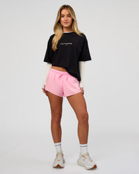 Woman wearing VS1 Enjoy The Journey FLXCotton Oversize Tee - Black | Model:Issy | Size:XS | Thumbnail Index: 9