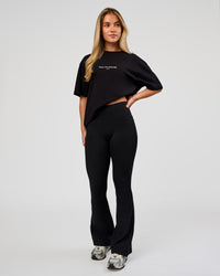 Woman wearing VS1 Enjoy The Journey FLXCotton Oversize Tee - Black | Model:Issy | Size:XS | Thumbnail Index: 11