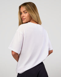 Woman wearing VS1 Enjoy The Journey FLXCotton Oversize Tee - White | Model:Issy | Size:XS | Thumbnail Index: 4
