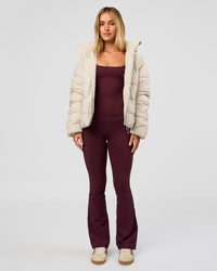 Woman wearing Go-To Puffer Jacket - Shale Beige | Model:Izzy | Size:XS | Thumbnail Index: 2