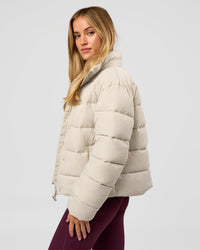 Woman wearing Go-To Puffer Jacket - Shale Beige | Model:Izzy | Size:XS | Thumbnail Index: 4