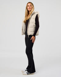 Woman wearing Go-To Puffer Vest - Shale Beige | Model:Izzy | Size:XS | Thumbnail Index: 4