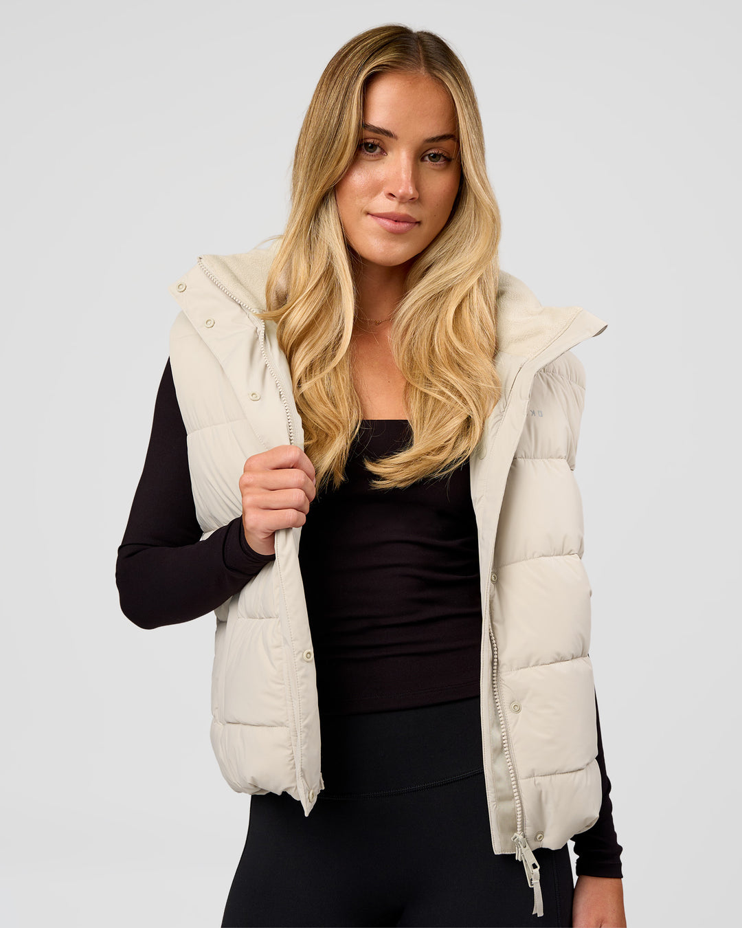 Woman wearing Go-To Puffer Vest - Shale Beige | Model:Izzy | Size:XS - view 6