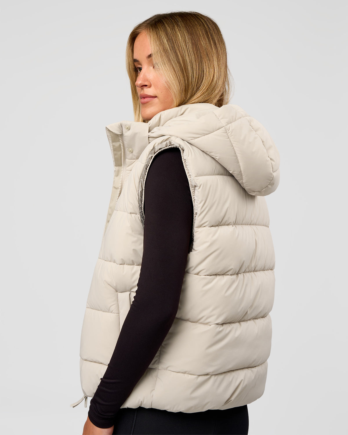 Woman wearing Go-To Puffer Vest - Shale Beige | Model:Izzy | Size:XS