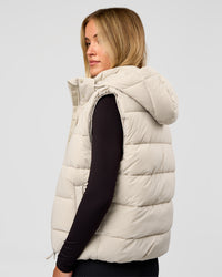 Woman wearing Go-To Puffer Vest - Shale Beige | Model:Izzy | Size:XS | Thumbnail Index: 1