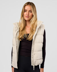 Woman wearing Go-To Puffer Vest - Shale Beige | Model:Izzy | Size:XS | Thumbnail Index: 6
