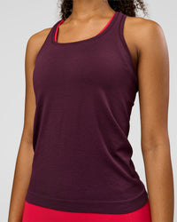 Woman wearing AeroFLX+ Seamless Tank - Cherry Lacquer/Cherry Lacquer | Model:Jordan | Size:XS | Thumbnail Index: 2