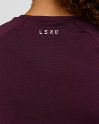 Woman wearing AeroFLX+ Seamless Tee - Cherry Lacquer/Cherry Lacquer | Model:Jordan | Size:XS | Thumbnail Index: 5