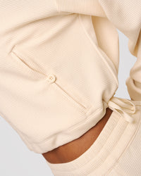 Woman wearing CloudWaffle Midi Zip Up - Vanilla Bean | Model:Jordan | Size:XS | Thumbnail Index: 4