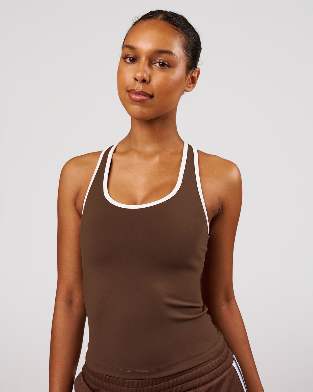 Woman wearing Flow Rep Scoop Neck Tank - Hot Chocolate-White | Model:Jordan | Size:XS - view 2