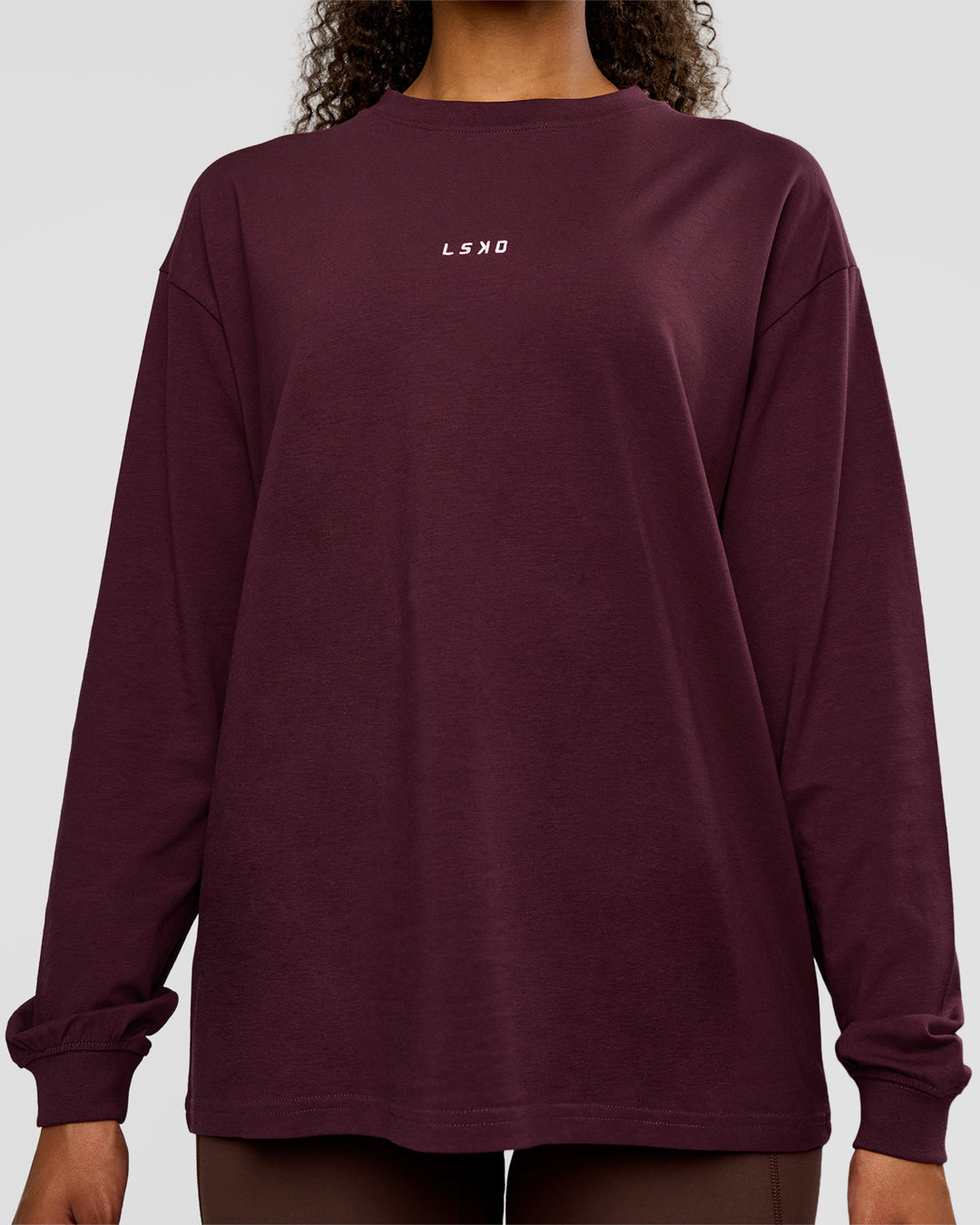 Woman wearing Go-To Long Sleeve FLXCotton Oversized Tee - Cherry Lacquer-White | Model:Jordan | Size:XS - view 2