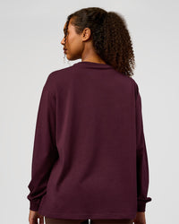 Woman wearing Go-To Long Sleeve FLXCotton Oversized Tee - Cherry Lacquer-White | Model:Jordan | Size:XS | Thumbnail Index: 2