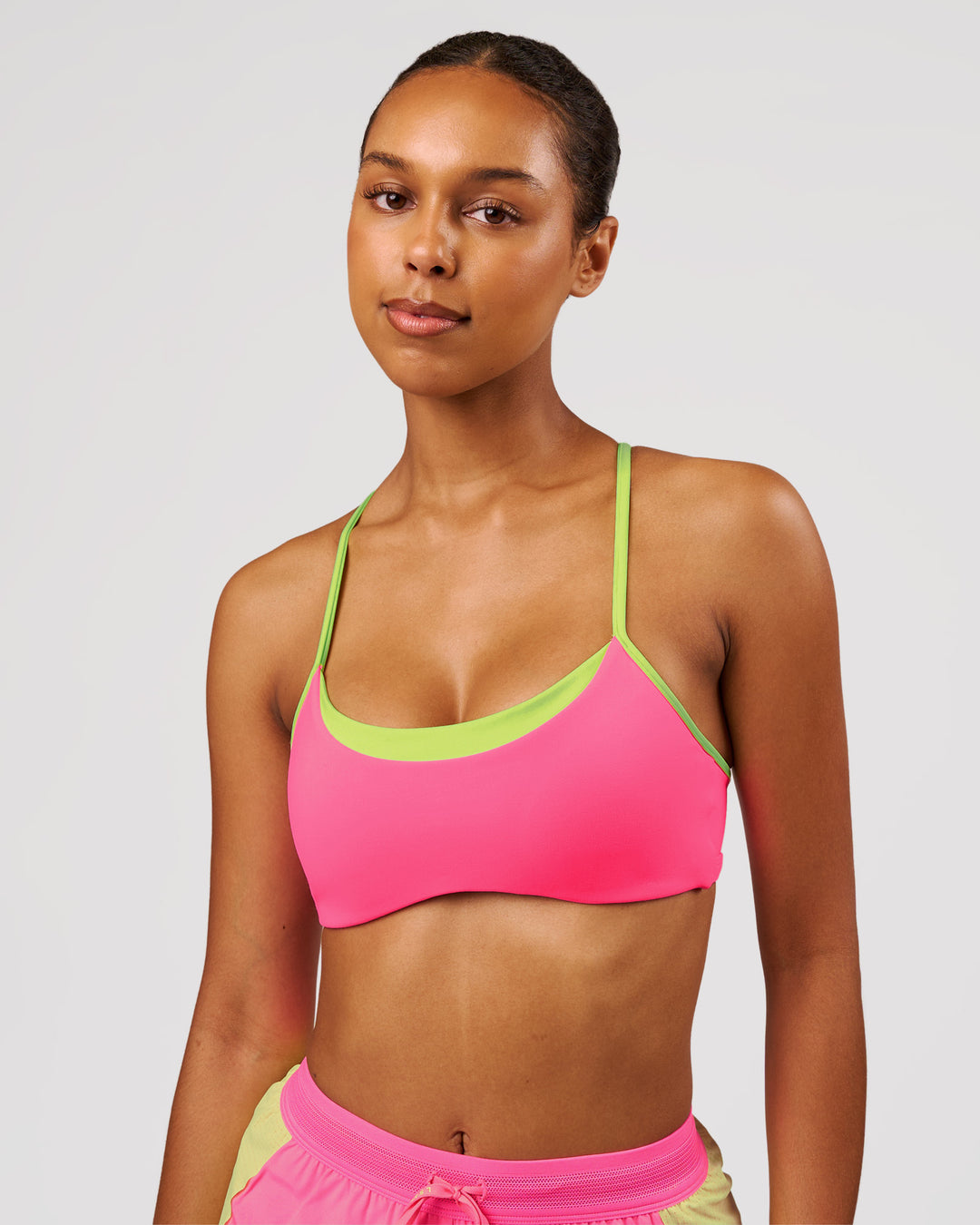 Woman wearing Tempo Sports Bra - Sugar Plum-Lime Glo | Model:Jordan | Size:XS - view 2