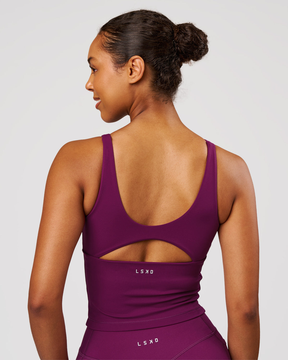 Woman wearing Vitality Active Tank - Plum Caspia | Model:Jordan | Size:XS - view 2