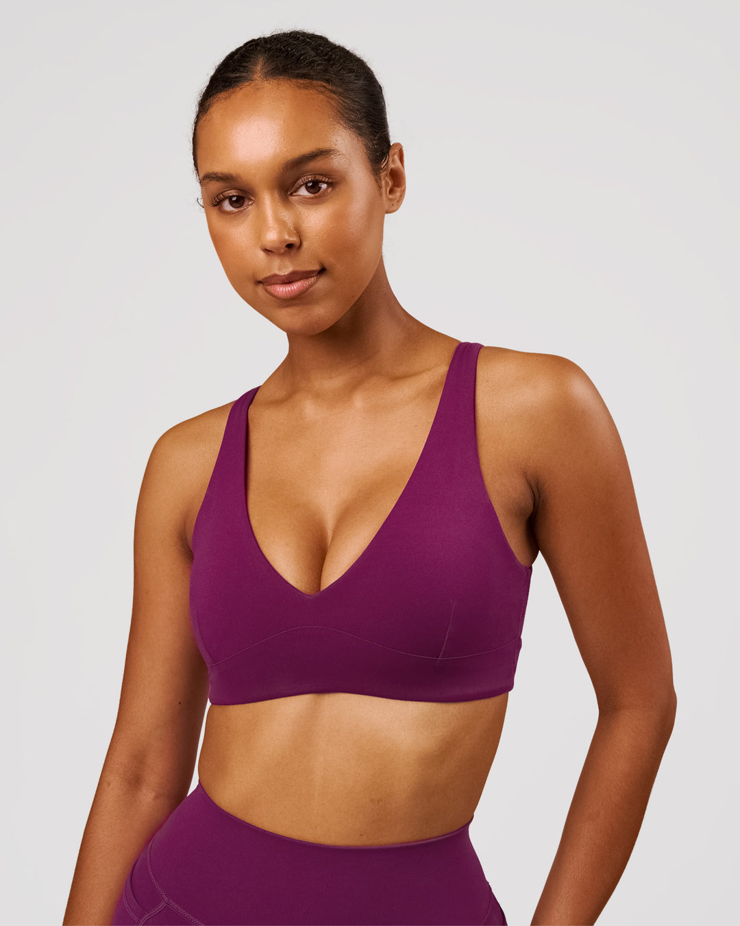 Woman wearing Vitality Sports Bra - Plum Caspia | Model:Jordan | Size:XS - view 3